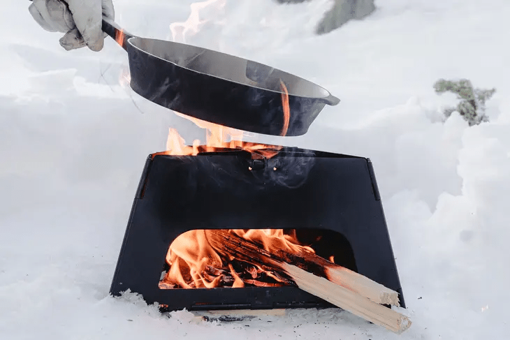 https://store.overlandbound.com/cdn/shop/products/flatbrook-folding-stove-339886_1400x.png?v=1701800398